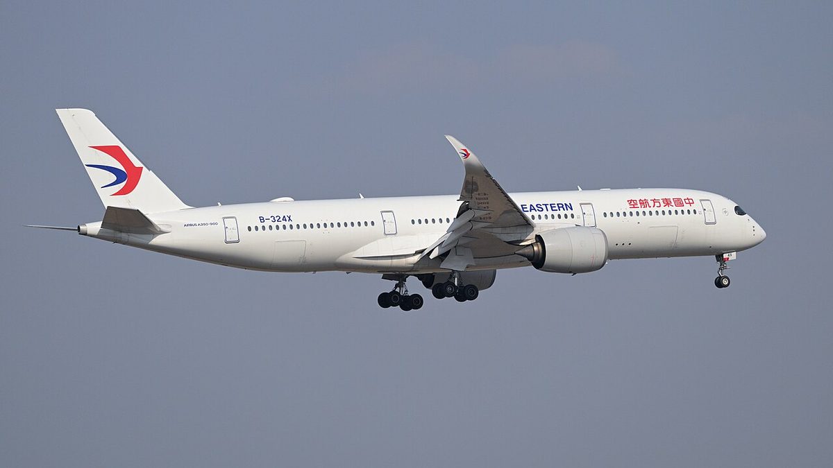 China Eastern Airlines modern Airbus widebody passenger jet on final approach to Shanghai Hongqiao airport