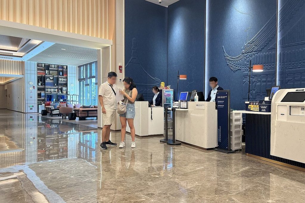 Modern hotel reception check-in counter at Holiday Inn Express Beijing Zhongguancun Tech Park in China