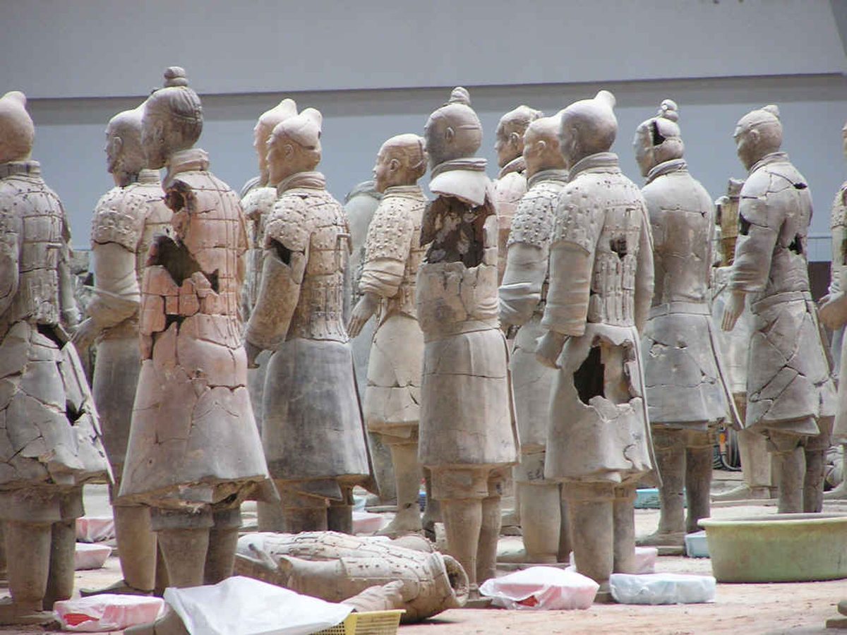 Vast ranks of life-sized earthenware soldiers and horses inside Pit 1 of the Terracotta Army museum in Xian
